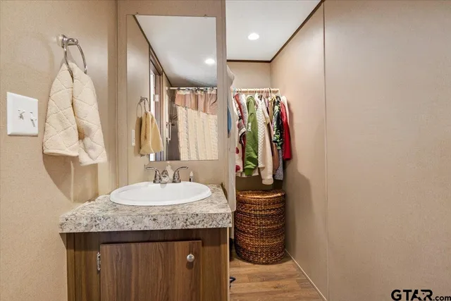 a white toilet sitting next to a shower curtain