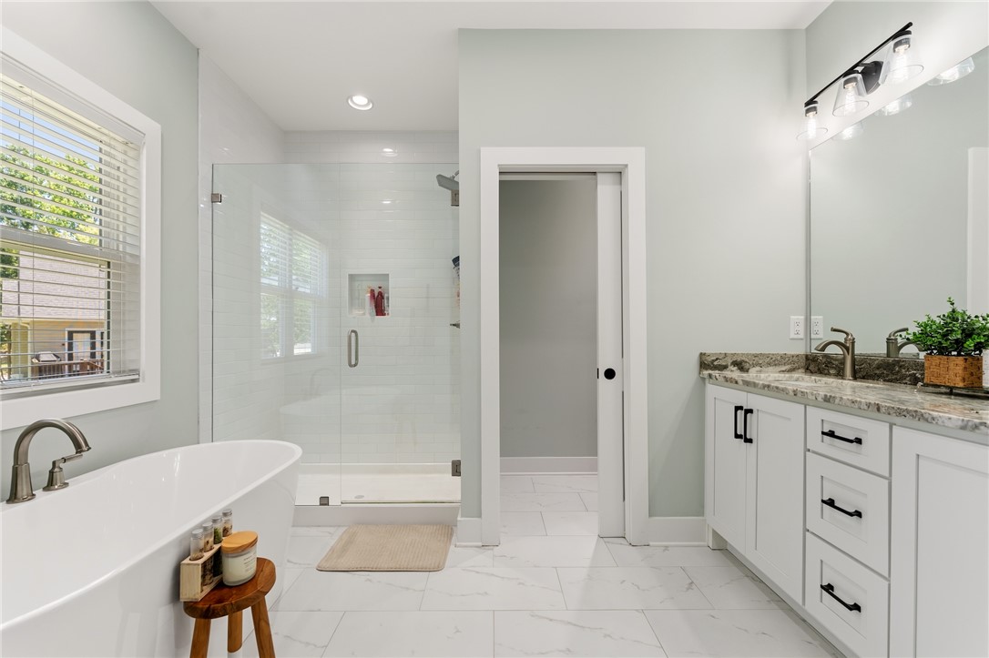 502 Canebrake Drive Anderson, SC 29621 - Photo 21 of 39 This serene bathroom offers a spacious layout with elegant fixtures for ultimate relaxation.