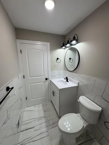 a view of an empty room and wooden floor