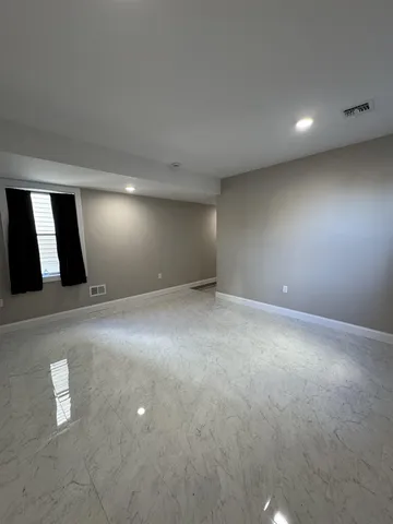 a bathroom with a toilet and a bathtub