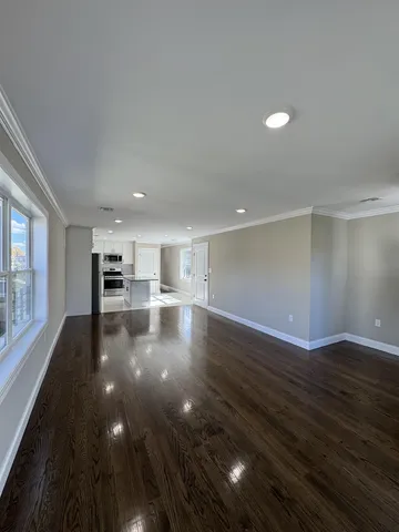 a view of a kitchen with a sink and a stove top oven