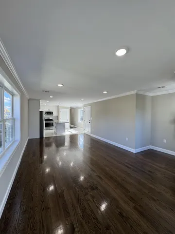 a view of a kitchen with a sink and a stove top oven
