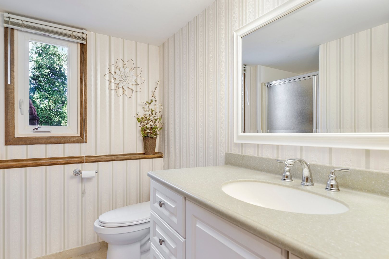 10900 Bryant Road Mokena, IL 60448 - Photo 6 of 14 a bathroom with a granite countertop sink a toilet and a mirror