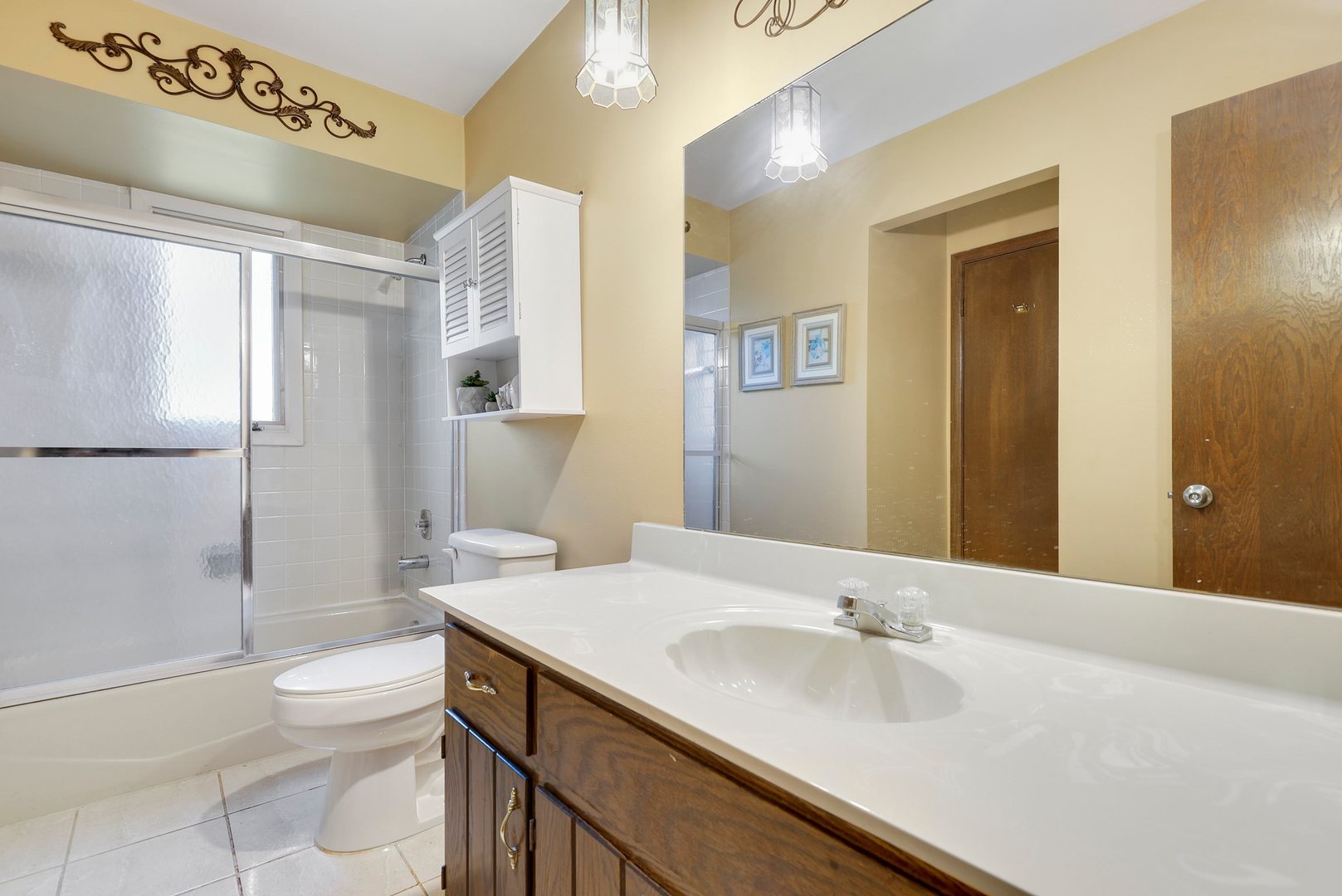 10900 Bryant Road Mokena, IL 60448 - Photo 10 of 14 a bathroom with a granite countertop sink toilet and shower