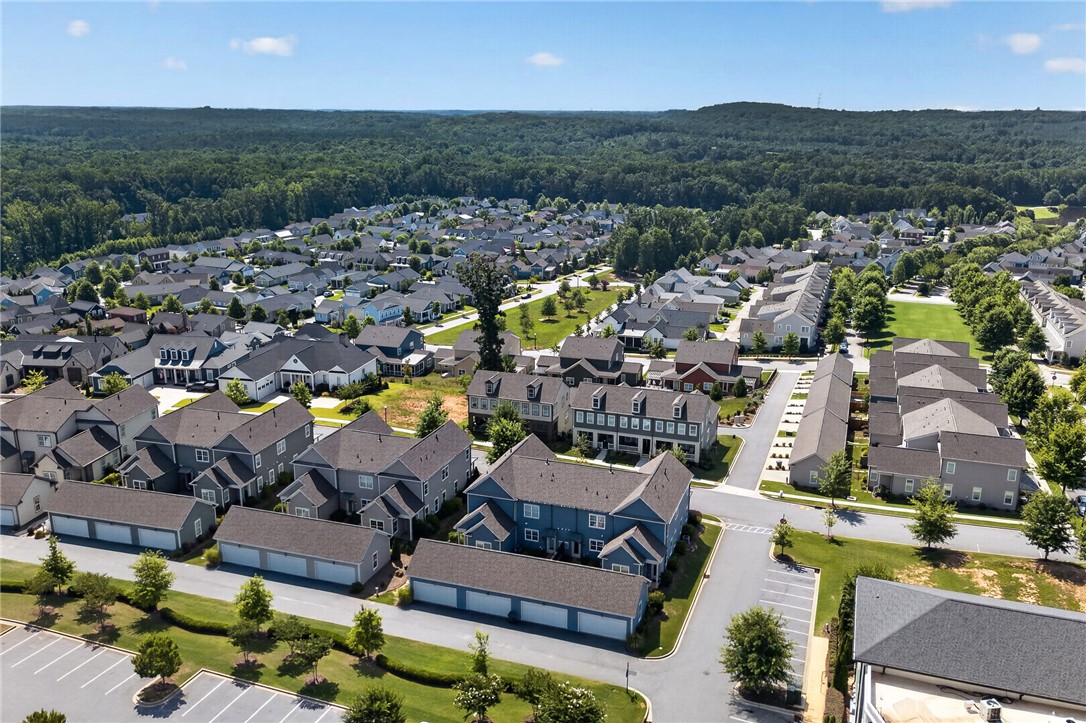 112 Tuttle Street Clemson, SC 29631 - Photo 39 of 46 An aerial perspective reveals a serene residential community bordered by verdant woodlands, complete with a network of inviting streets.