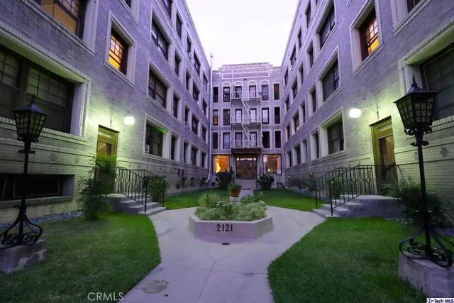 a view of a building with a yard