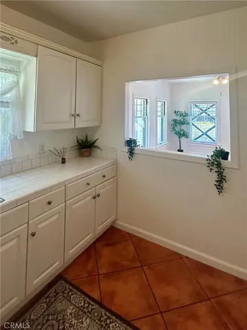 a kitchen with a cabinets and window