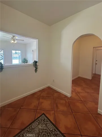 a view of a room with wooden floor and white walls