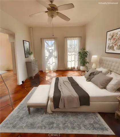 a bedroom with a bed window and couch