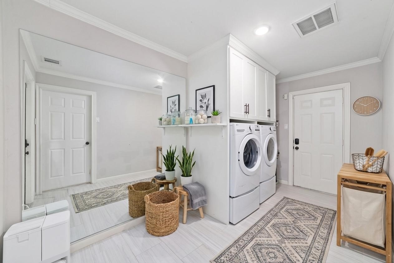 10607 Chimney Rock Road Houston, TX 77096 - Photo 34 of 35 Bright, clean, and functional with plenty of storage. Everyday tasks just got a lot easier.