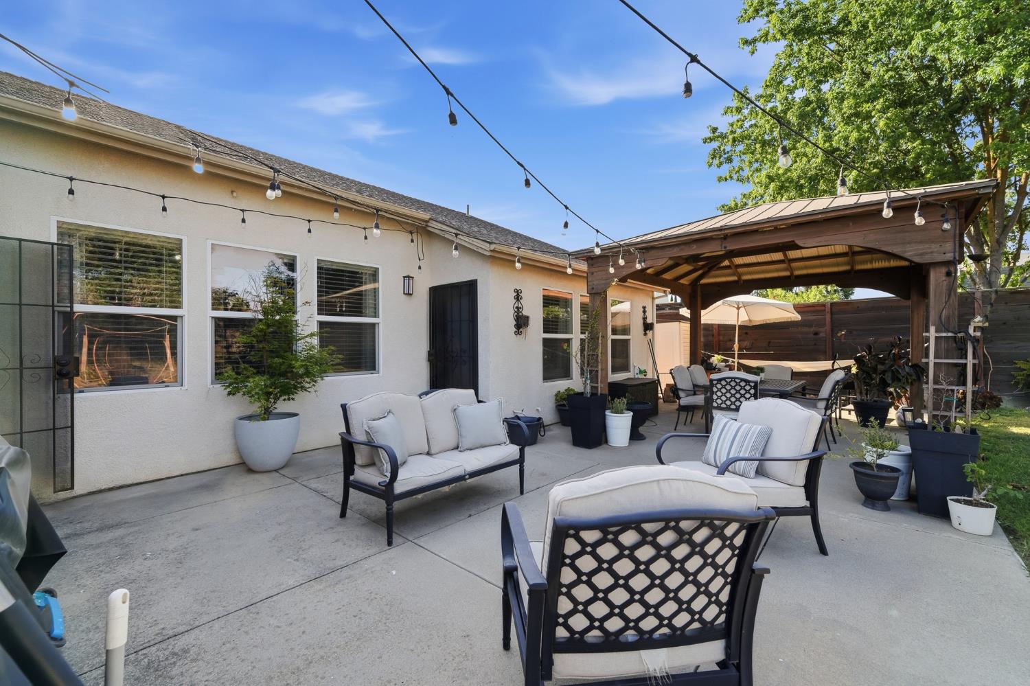 2220 Ellison Drive Modesto, CA 95355 - Photo 45 of 53 a view of a patio with couches and potted plants