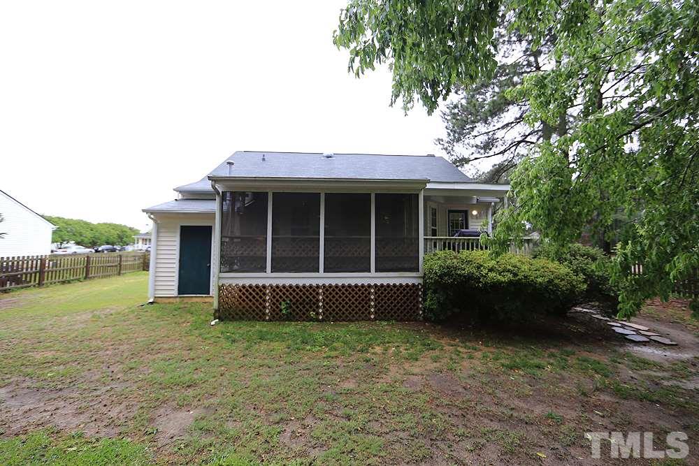 409 Flagg Road Holly Springs, NC 27540 - Photo 13 of 14 View of the back of the house and screened porch.