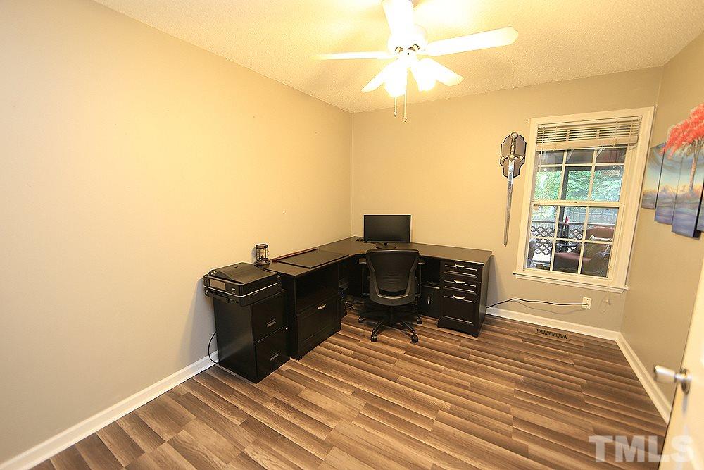 409 Flagg Road Holly Springs, NC 27540 - Photo 8 of 14 This bedroom has new flooring and a ceiling fan.