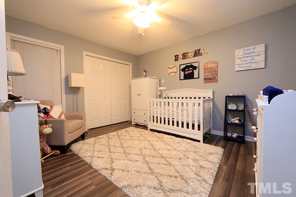 409 Flagg Road Holly Springs, NC 27540 - Photo 9 of 14 This bedroom has new flooring and a ceiling fan.