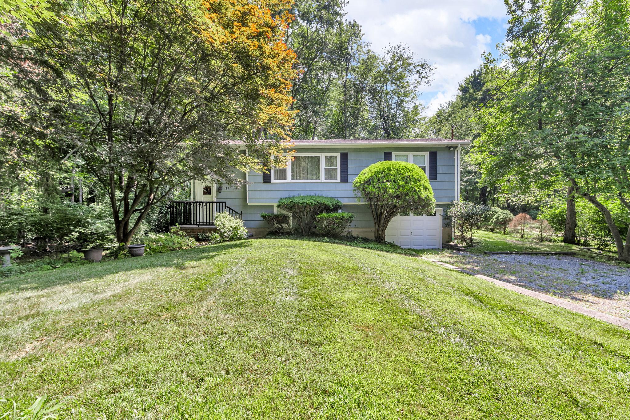 14 Griffen Road Brewster, NY 10509 - Photo 2 of 30 a front view of a house with a yard and trees
