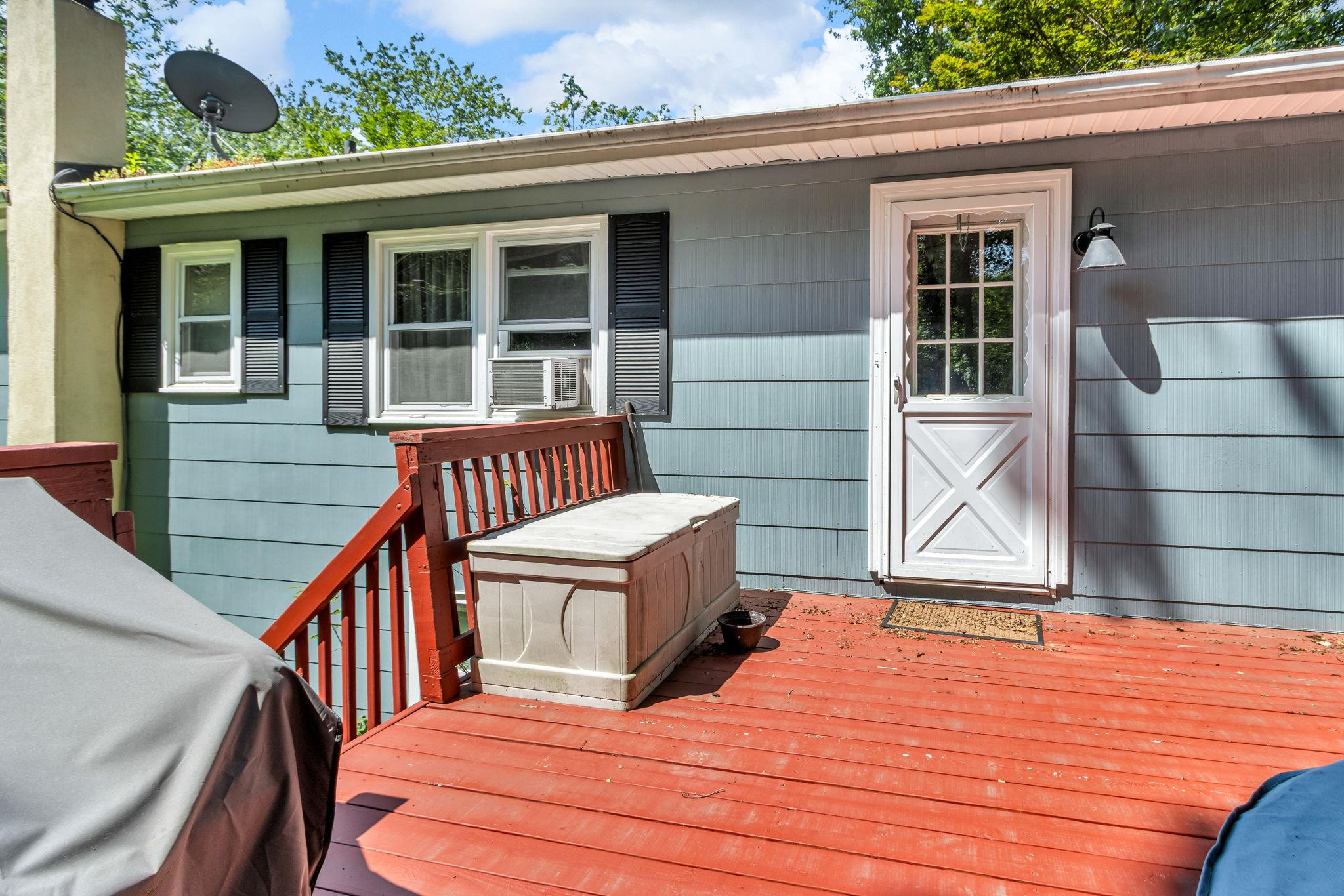 14 Griffen Road Brewster, NY 10509 - Photo 28 of 30 a backyard of a house with wooden deck and furniture