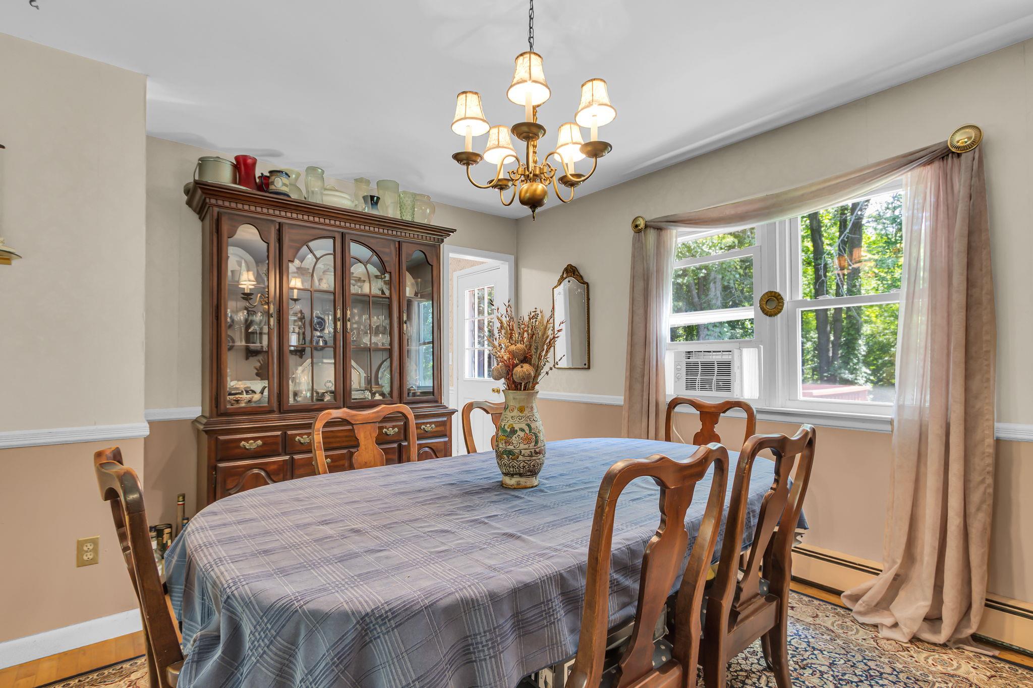 14 Griffen Road Brewster, NY 10509 - Photo 8 of 30 a dining room with furniture a chandelier and window