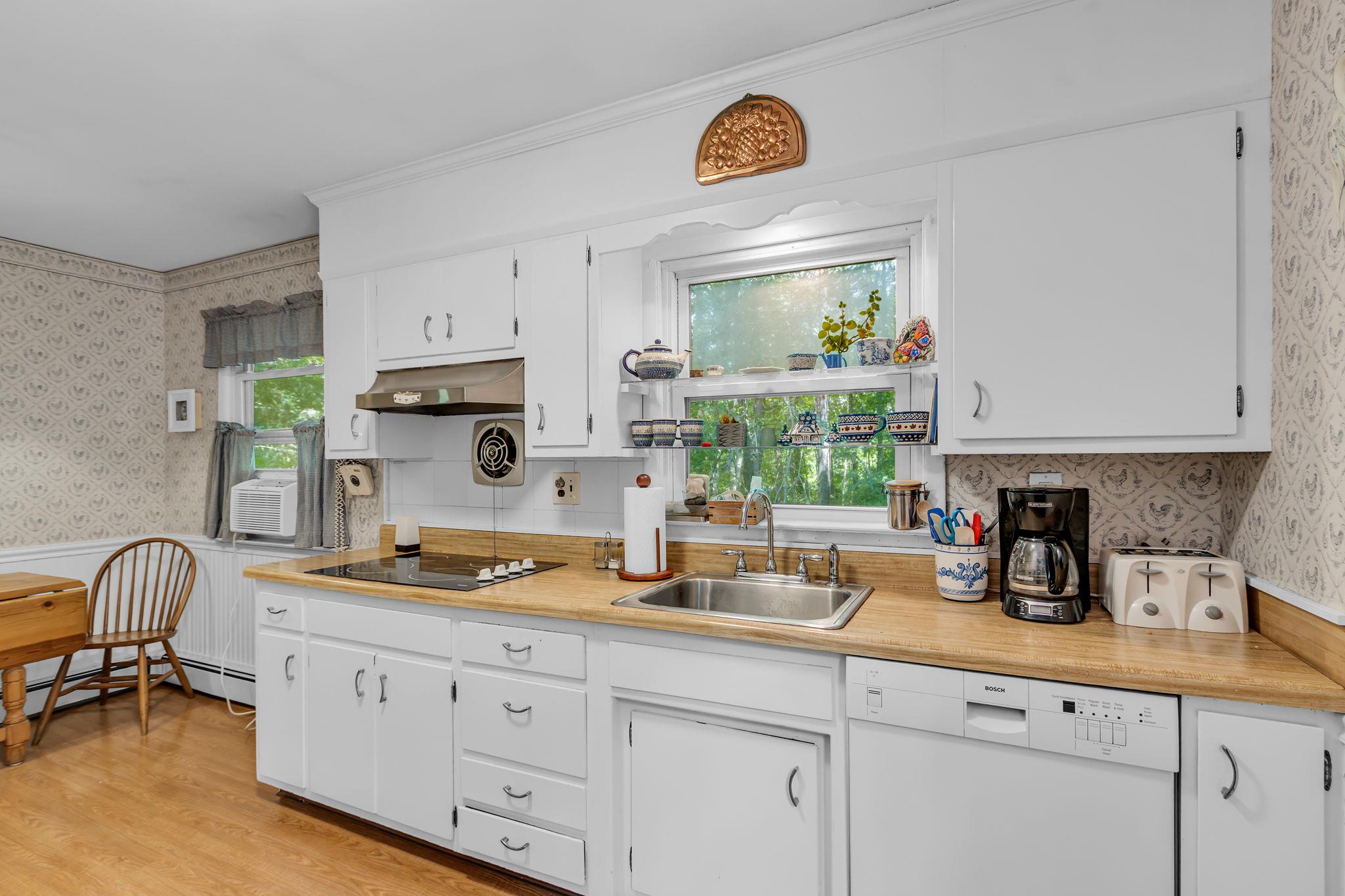 14 Griffen Road Brewster, NY 10509 - Photo 9 of 30 a kitchen with stainless steel appliances granite countertop a sink a stove and a refrigerator