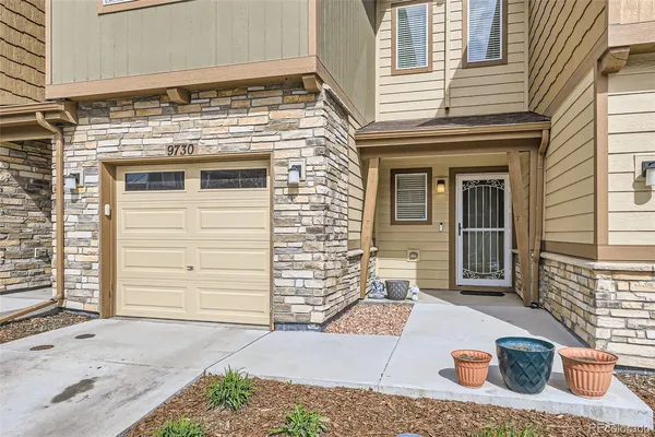 a front view of a house with a garage