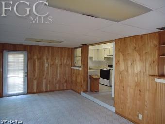 4852 Riverside Drive Estero, FL 33928 - Photo 4 of 9 a view of an empty room with a fireplace and a window