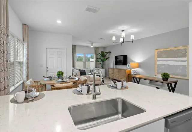 a workspace room with furniture and window