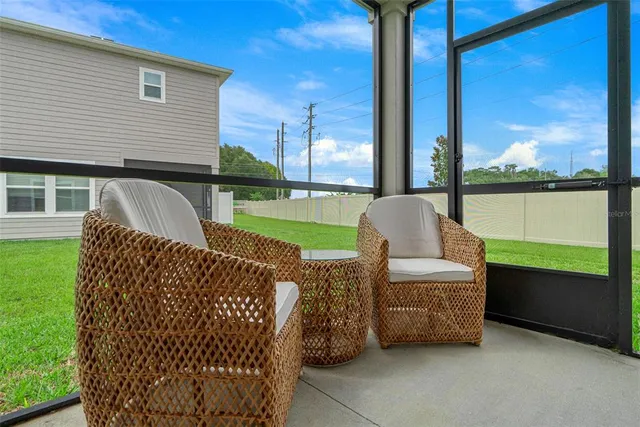 a spacious bedroom with a bed and a couch