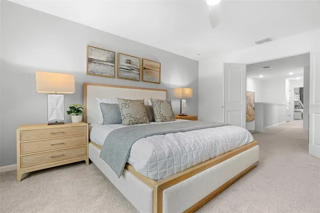 a bed room with a bed and a night stand