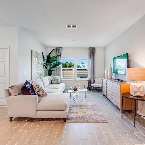 a living room with furniture and a couch