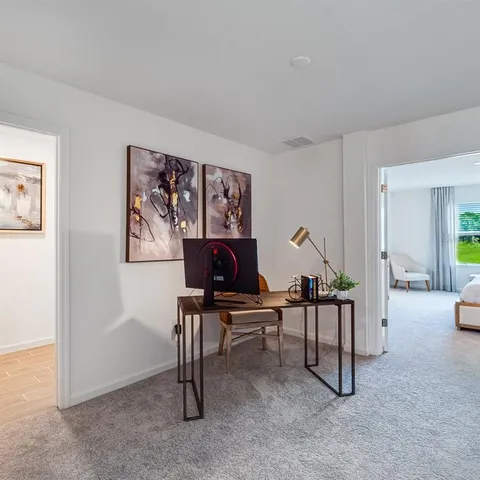 a bedroom with a bed and a couch