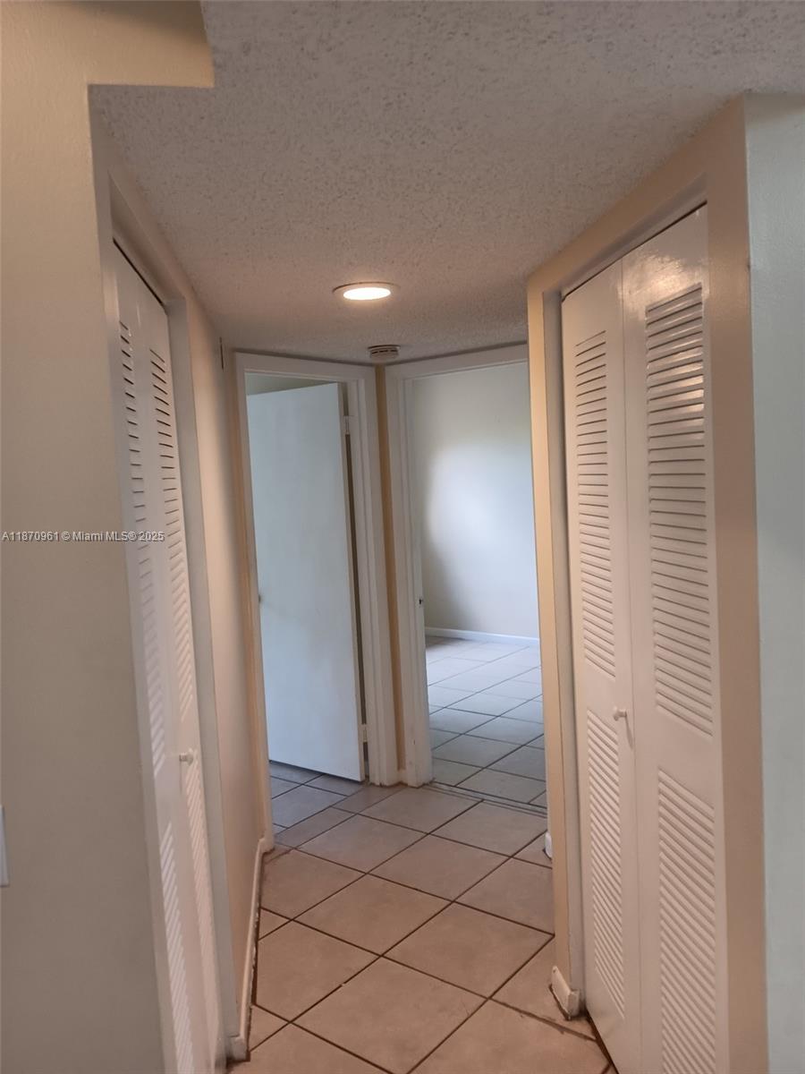 8821 Wiles Road, Unit 308 Coral Springs, FL 33067 - Photo 11 of 18 a view of hallway