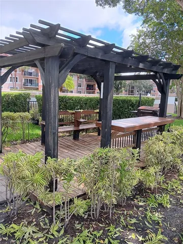 a view of a porch with a bench in patio