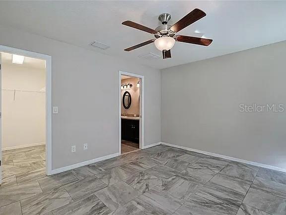 6367 Southwest 117th St Road Ocala, FL 34476 - Photo 13 of 22 an empty room with a window and a fan