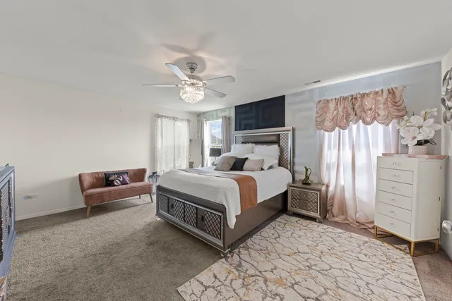 a bedroom with a bed and a couch