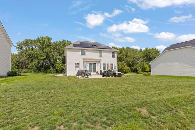 a view of a house with a yard