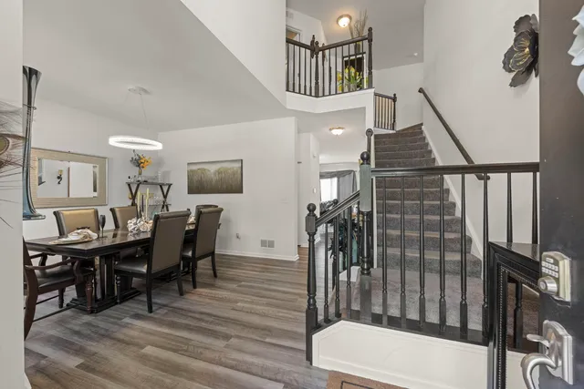 a view of a livingroom with furniture and staircase
