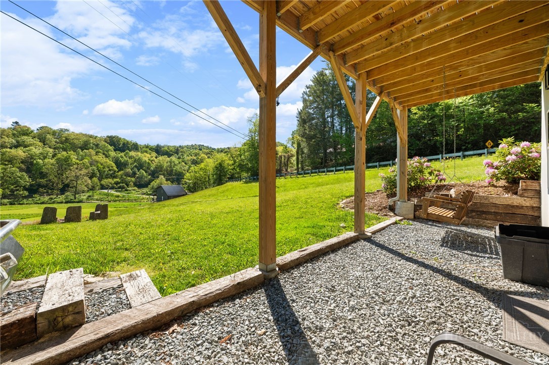 634-636 Watauga River Road Sugar Grove, NC 28679 - Photo 14 of 50 a view of a porch with a backyard