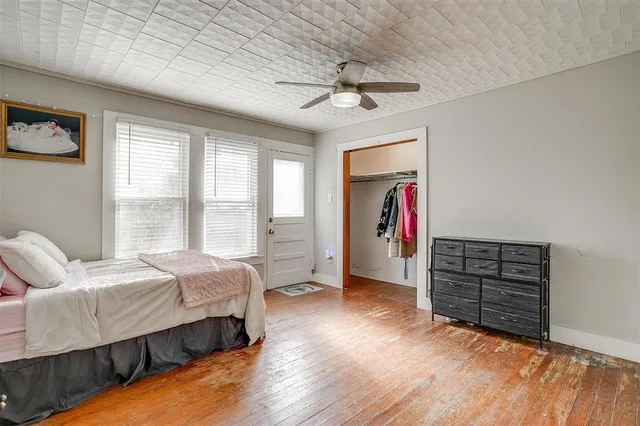 a bedroom with bed and window