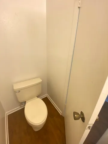 a white toilet sitting next to a sink