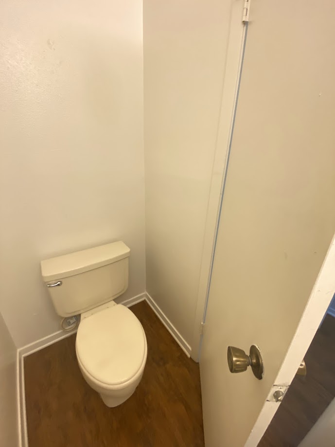 1305 West Villa Maria Road, Unit C103 Bryan, TX 77801 - Photo 11 of 19 a white toilet sitting next to a sink