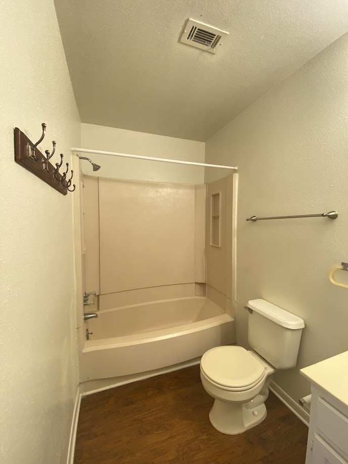 1305 West Villa Maria Road, Unit C103 Bryan, TX 77801 - Photo 19 of 19 a bathroom with a toilet and shower