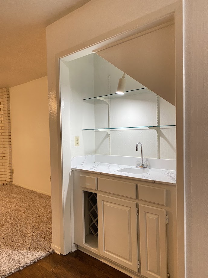 1305 West Villa Maria Road, Unit C103 Bryan, TX 77801 - Photo 3 of 19 a kitchen with a sink and cabinets