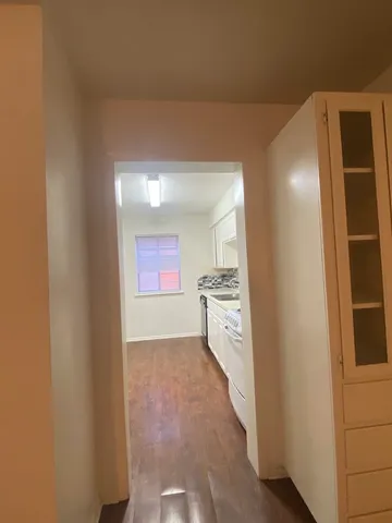 a view of hallway with washer and dryer