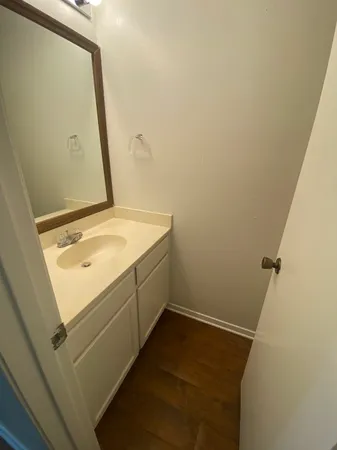 a bathroom with a sink and vanity