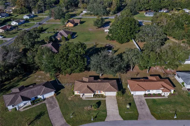 an aerial view of a house with outdoor space