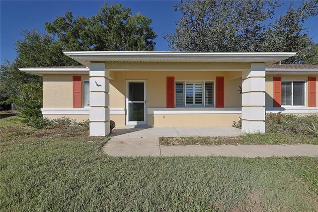 front view of a house with a yard