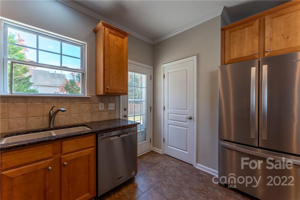 261 Sand Paver Way Fort Mill, SC 29708 - Photo 12 of 45 a kitchen with stainless steel appliances granite countertop a refrigerator and a sink