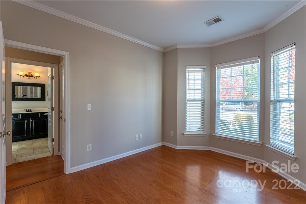 261 Sand Paver Way Fort Mill, SC 29708 - Photo 24 of 45 a view of an empty room with glass door and wooden floor
