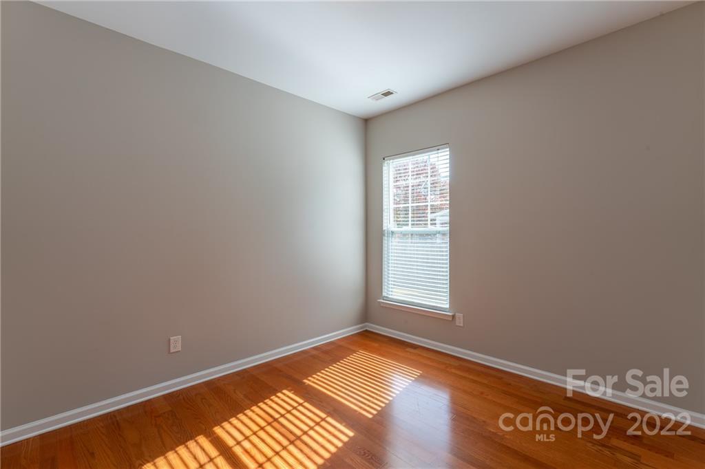 261 Sand Paver Way Fort Mill, SC 29708 - Photo 28 of 45 an empty room with wooden floor and windows