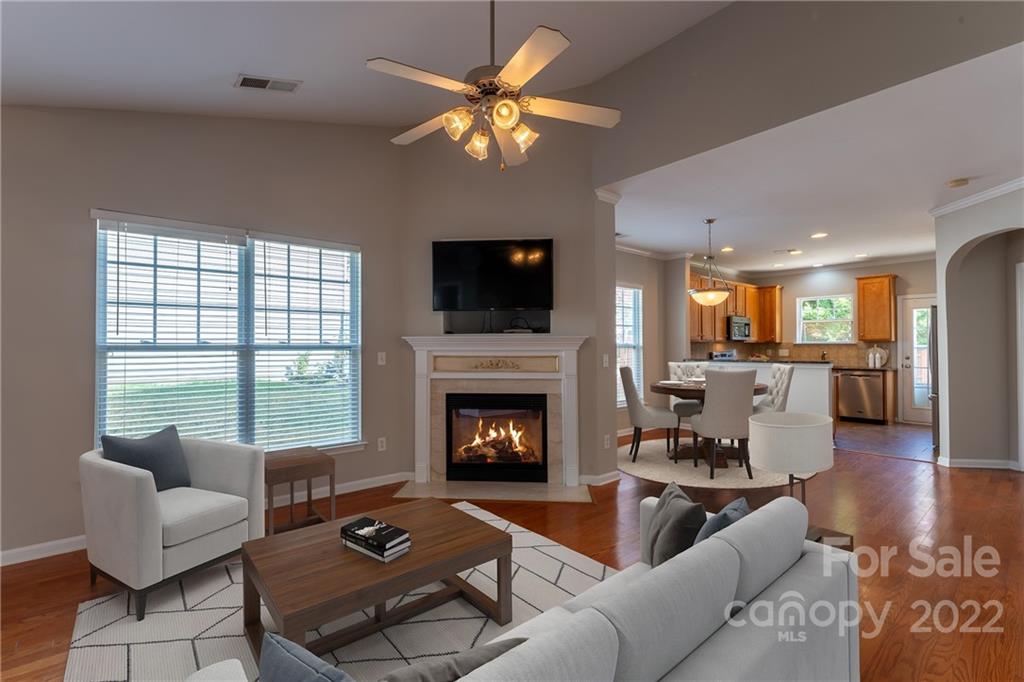 261 Sand Paver Way Fort Mill, SC 29708 - Photo 6 of 45 a living room with furniture a fireplace and a flat screen tv