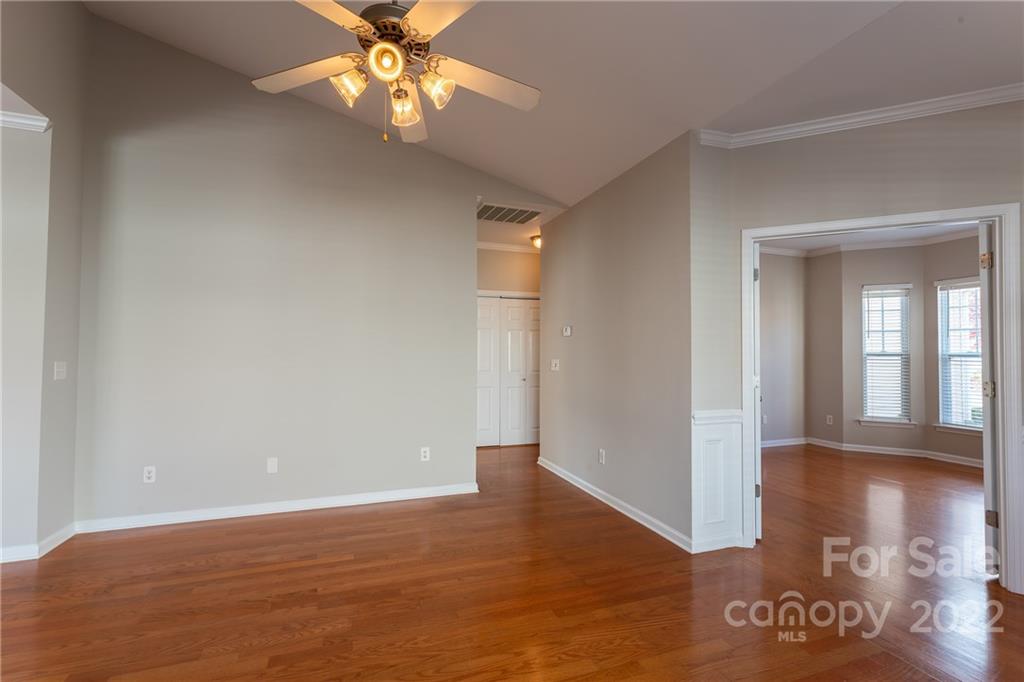 261 Sand Paver Way Fort Mill, SC 29708 - Photo 9 of 45 a view of an empty room with window and wooden floor
